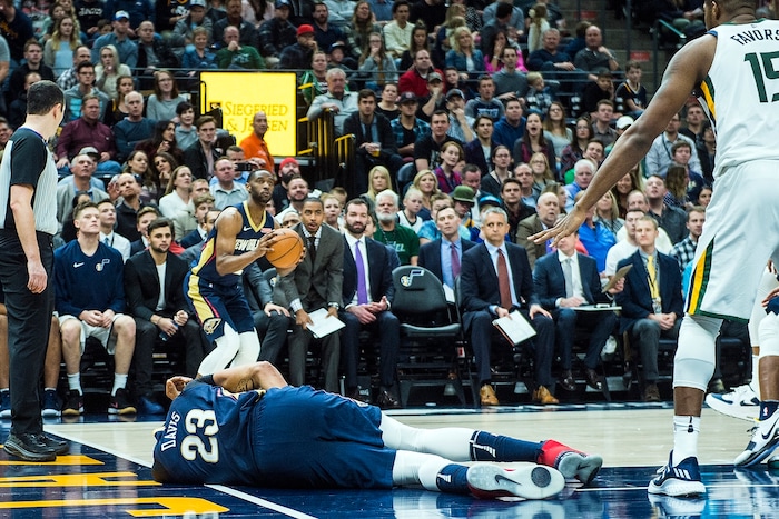 (Chris Detrick  |  The Salt Lake Tribune)  New Orleans Pelicans forward Anthony Davis (23) remains on the ground after getting injured during the game at Vivint Smart Home Arena Friday, December 1, 2017.  Utah Jazz defeated New Orleans Pelicans 114-108.