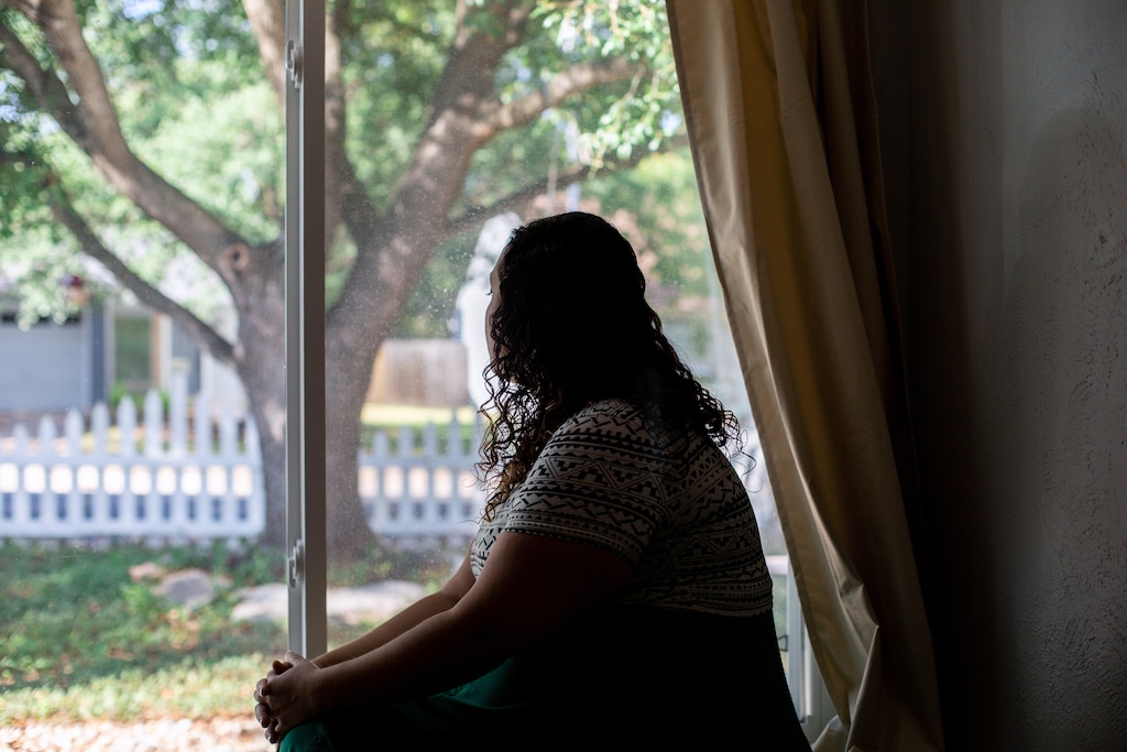 (Liz Moskowitz/The New York Times)
A critical care nurse, who requested anonymity to discuss her experience, at her home in Texas on July 15, 2022. While pregnant, her water broke at 19 weeks. When doctors would not conduct an abortion until she was actively sick, she and her husband flew to Colorado for the procedure.