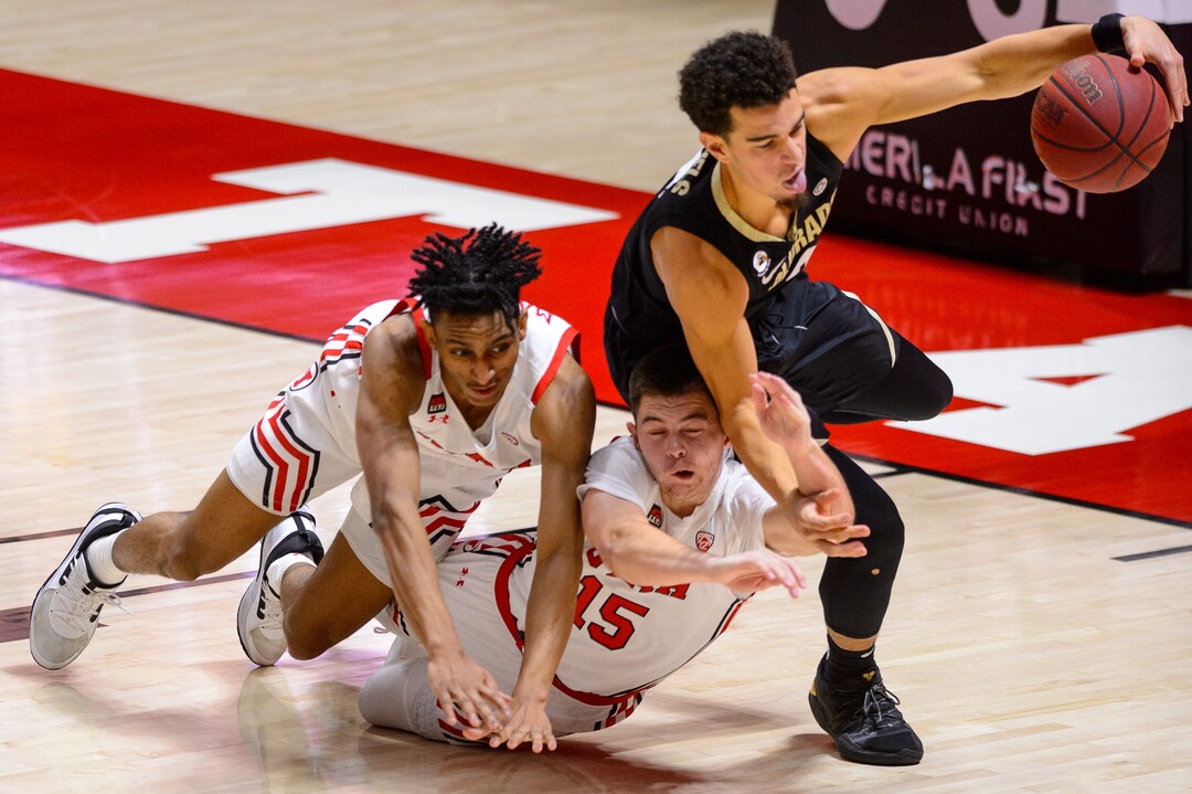 (Trent Nelson  |  The Salt Lake Tribune) Utah Utes guard Ian Martinez (2), Utah Utes guard Rylan Jones (15), and Colorado Buffaloes guard Maddox Daniels (3) scramble for a loose ball as Utah hosts Colorado, NCAA basketball in Salt Lake City on Monday, Jan. 11, 2021.