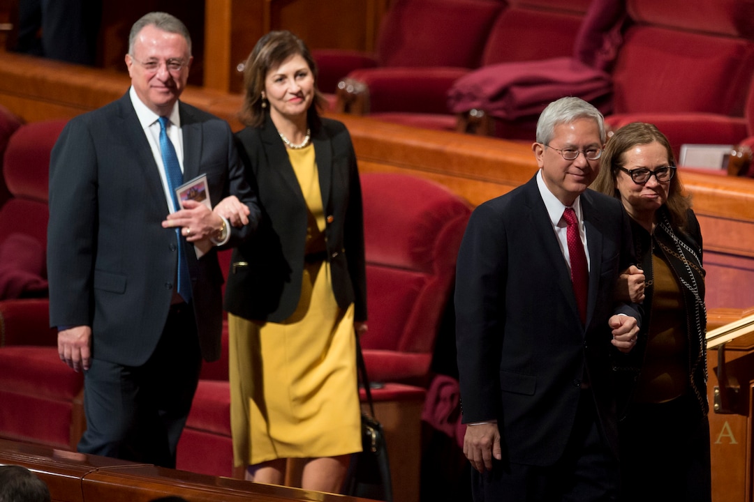 (Jeremy Harmon  |  The Salt Lake Tribune) Elder Ulisses Soares and Elder Gerrit W. Gong leave conference with their wives at the end of the Sunday morning session of General Conference on April 1, 2018.