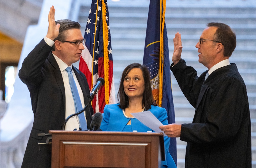 (Rick Egan | The Salt Lake Tribune) Elaine Oaks (Center) watches as Marlo Oaks is sworn in as the 26th Treasurer of Utah by Associate Chief Justice Thomas R. Lee, in a swearing-in ceremony at the Capitol Rotunda on Tuesday, July 20, 2021.