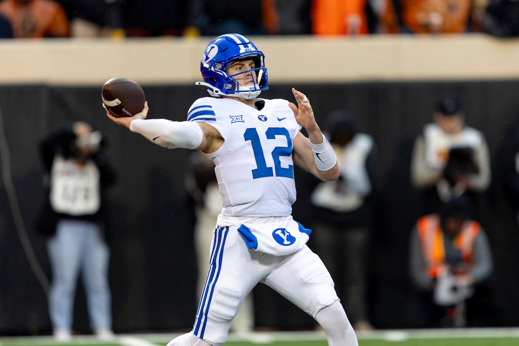 (Mitch Alcala | AP) BYU quarterback Jake Retzlaff (12) passes the ball in the first half of a game against Oklahoma State on Nov. 25, 2023, in Stillwater, Okla. BYU has declined to say whether Retzlaff or transfer Gerry Bohanon will start in the season-opener.