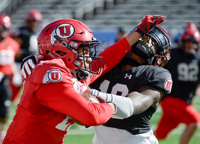 (Francisco Kjolseth  |  The Salt Lake Tribune)  Solomon Enis, #21, battles Vonte Davis, #19, as the Utah Utes hold their first of two major scrimmages of spring practice at Rice Eccles stadium on Saturday, March 30, 2019, prior to the April 13 Red-White Game. 