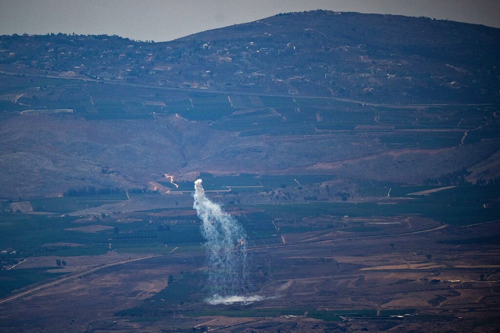 An Israeli shelling hits an area in Lebanon next to the Israeli-Lebanese border at the Galilee region as seen from the Israel-annexed Golan Heights, Monday, Aug. 5, 2024. (AP Photo/Leo Correa)
