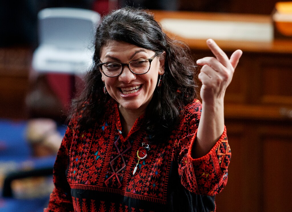 In this Thursday, Jan. 3, 2019 photo, then Rep.-elect Rashida Tlaib of Michigan, is shown on the house floor before being sworn into the 116th Congress at the U.S. Capitol in Washington. Tlaib exclaimed at an event late Thursday that Democrats were going to “impeach the mother------.” According to video and comments on Twitter, she apparently made the comments during a party hosted by the liberal activist group MoveOn. (AP Photo/Carolyn Kaster)