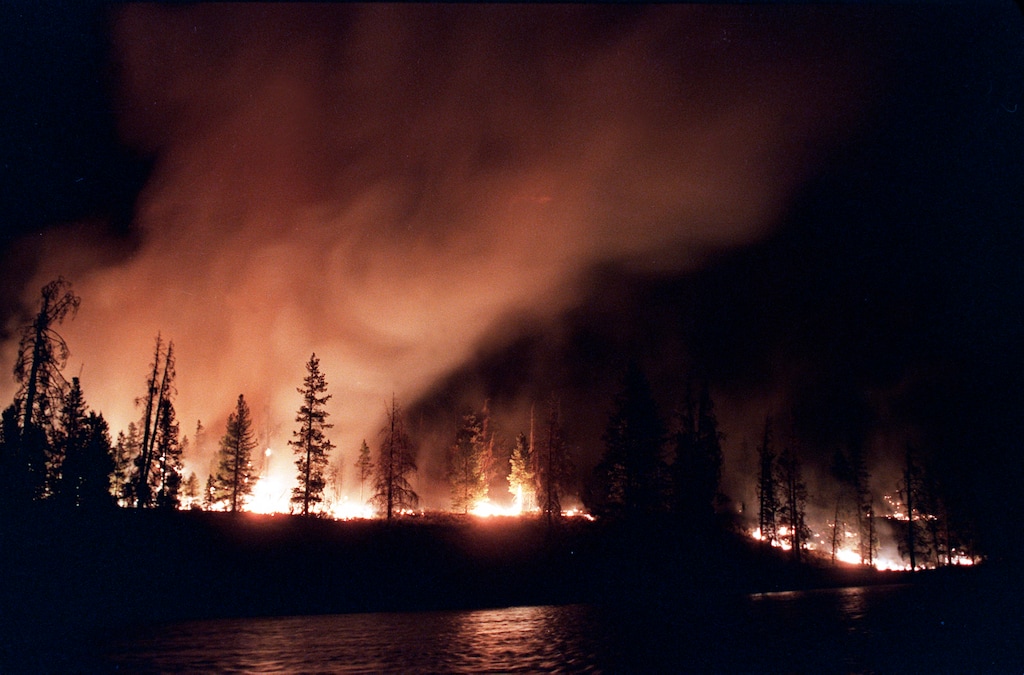 (Tannen Maury | AP file photo)  In this Sept. 2, 1988, file photo, a forest fire blazes out of control near West Yellowstone in Yellowstone National Park, Mont.