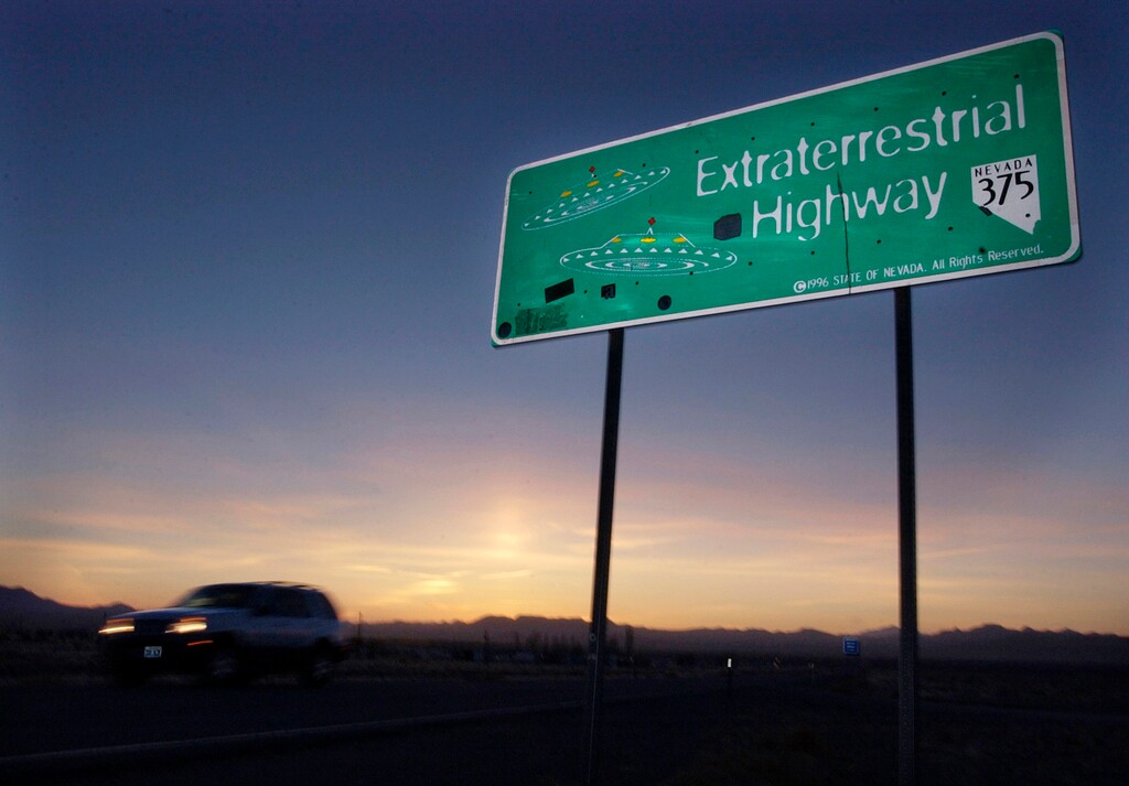 FILE - In this April 10, 2002, file photo, a vehicle moves along the Extraterrestrial Highway near Rachel, Nev., the closest town to Area 51. The U.S. Air Force has warned people against participating in an internet joke suggesting a large crowd of people "storm Area 51," the top-secret Cold War test site in the Nevada desert. (AP Photo/Laura Rauch, File)