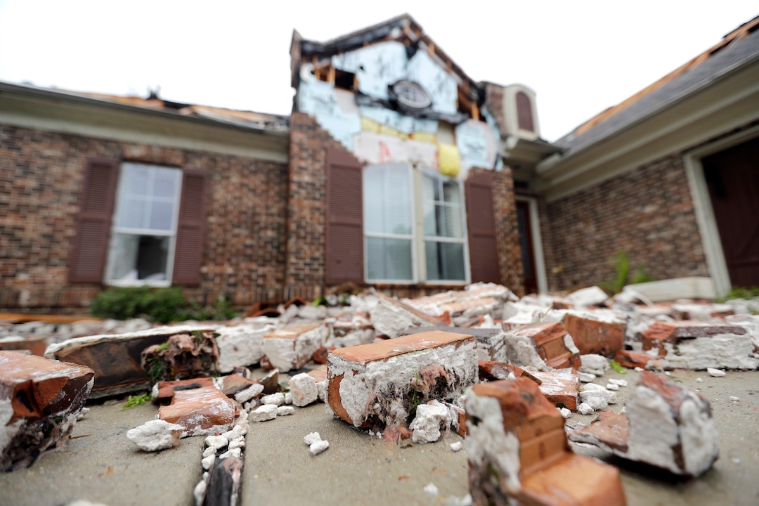 (David J. Phillip | The Associated Press) Fallen bricks from a home damaged by Hurricane Harvey sit on the ground Saturday, Aug. 26, 2017, in Missouri City, Texas.  Harvey rolled over the Texas Gulf Coast on Saturday, smashing homes and businesses and lashing the shore with wind and rain so intense that drivers were forced off the road because they could not see in front of them.