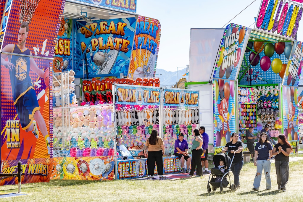 (Rick Egan | The Salt Lake Tribune) People enjoy the carnival at West Valley City's WestFest in Centennial Park on Wednesday, June 17, 2026.
