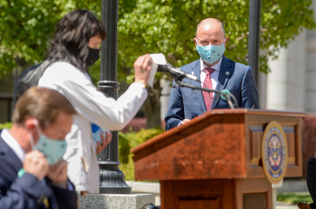 (Leah Hogsten  |  The Salt Lake Tribune) Lieutenant Governor Spencer Cox waits for the lecturn and microphone to be sanitized before promoting a 3-year campaign to promote education, provide resources, and change the culture around suicide and mental health in Utah on Thursday. The statewide campaign, Live On, is a statewide effort to help Utahns struggling with isolation, job loss and increased stress and anxiety surrounding COVID-19.