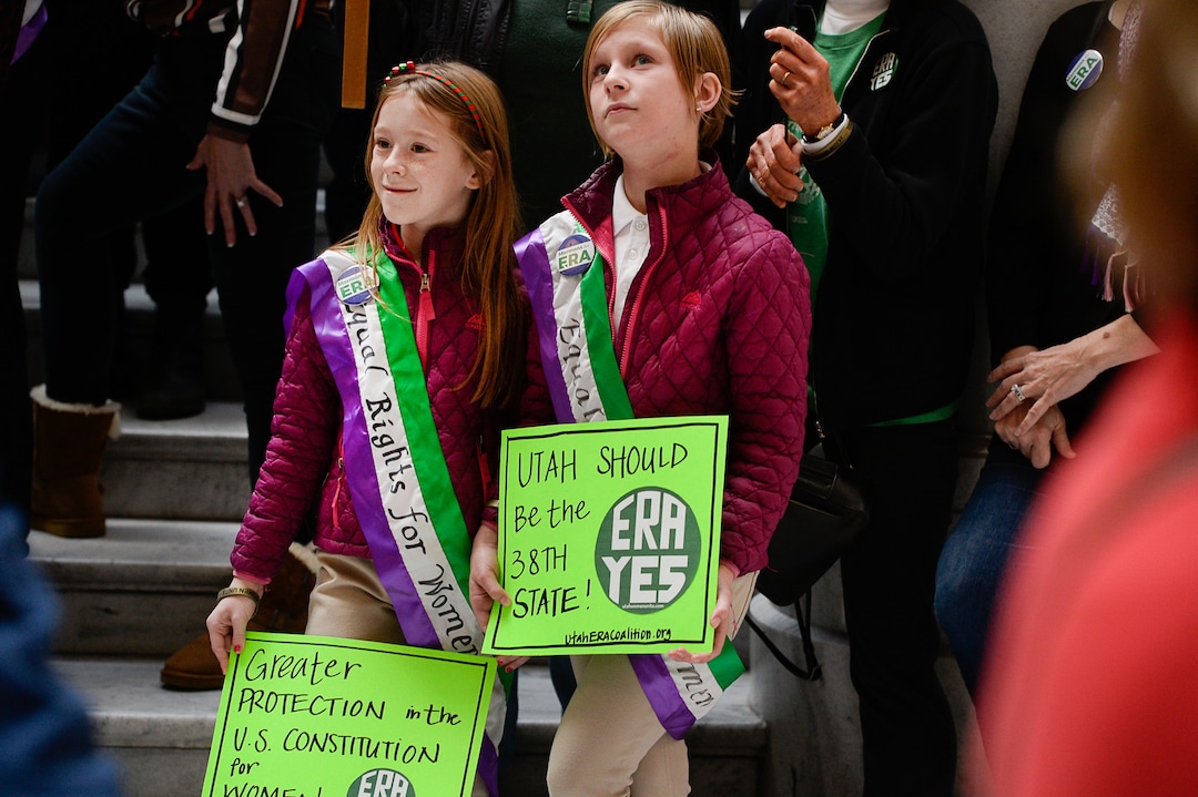 (Francisco Kjolseth  |  The Salt Lake Tribune)  Abby, left, and her twin sister Kate, 10, join other local supporters of the Equal Rights Amendment for a rally at the Utah Capitol on Tuesday, Dec. 3, 2019, to encourage Utah to ratify the ERA.