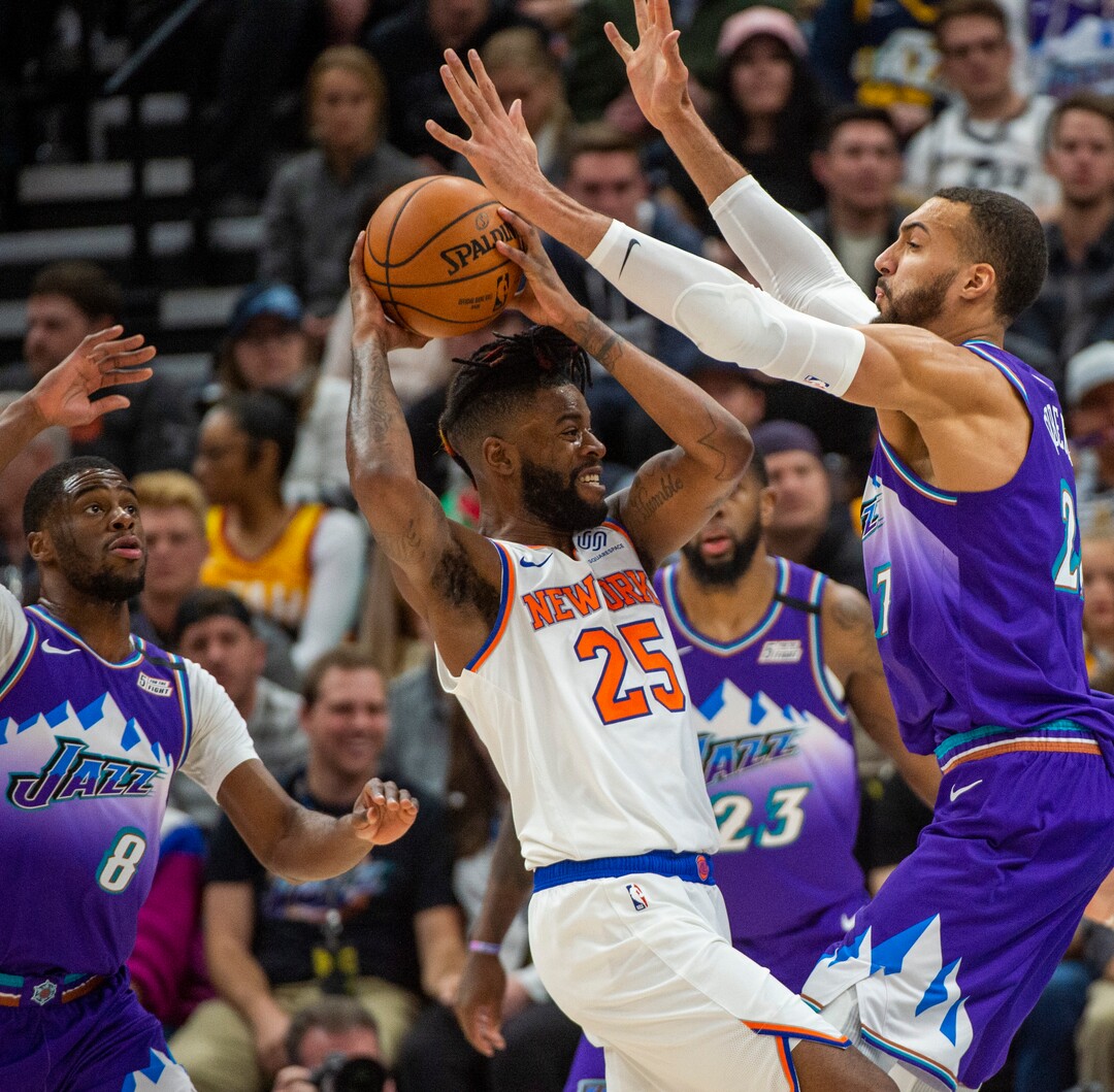 (Rick Egan  |  The Salt Lake Tribune) New York Knicks guard Reggie Bullock (25) is double-teamed by Utah Jazz guard Emmanuel Mudiay (8) and Utah Jazz center Rudy Gobert (27), in NBA action between the Utah Jazz and the New York Knicks, in Salt Lake City, Wednesday, Jan. 8, 2020.