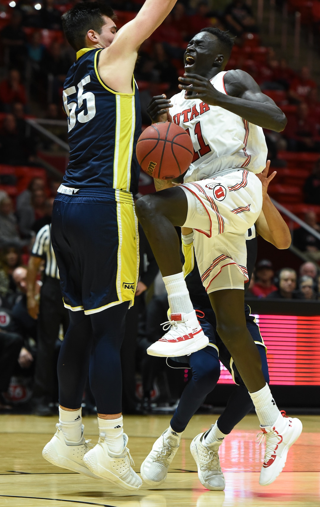 (Francisco Kjolseth  |  The Salt Lake Tribune)  Utah Utes forward Both Gach (11) gets blocked by Northern Arizona in Men's Basketball at the Jon M Huntsman Center in Salt Lake City, Utah, on Friday, Dec. 21, 2018.