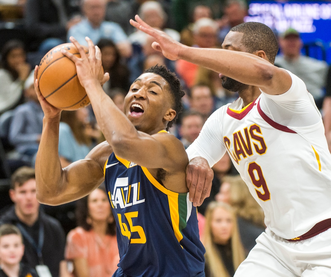 (Rick Egan  |  The Salt Lake Tribune)   Utah Jazz guard Donovan Mitchell (45) takes the ball inside as Cleveland Cavaliers guard Dwyane Wade (9) defends, in NBA action Utah Jazz vs Cleveland Cavaliers, in Salt Lake City,  Saturday, December 30, 2017.
