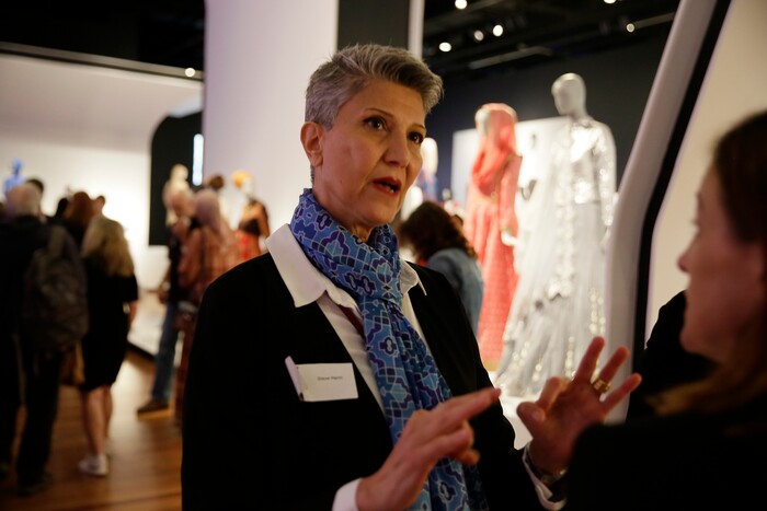 (Eric Risberg  |  AP Photo)  In this photo taken Thursday, Sept. 20, 2018, Gisue Hariri, one of two-Iranian born sisters whose architecture firm designed the exhibit Contemporary Muslim Fashions, talks about the exhibit during a preview at the M. H. de Young Memorial Museum in San Francisco. The first major museum exhibition of contemporary Muslim women's fashion reflects designs from around the world that are vibrant and elegant, playful and diverse. The show's creators hope the exhibit will show Muslim women as real people who can choose what they wear rather than as subjects ordered to cover their entire bodies or restricted in what they can wear. The exhibit opens on Saturday.