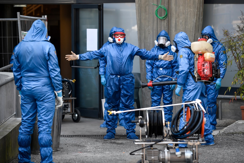 Members of a Russian team sanitize a hospice for elderly people to contain the spread of the Covid-19 virus, in Albino, near Bergamo, northern Italy, Saturday, March 28, 2020. The new coronavirus causes mild or moderate symptoms for most people, but for some, especially older adults and people with existing health problems, it can cause more severe illness or death. (Claudio Furlan/LaPresse via AP)