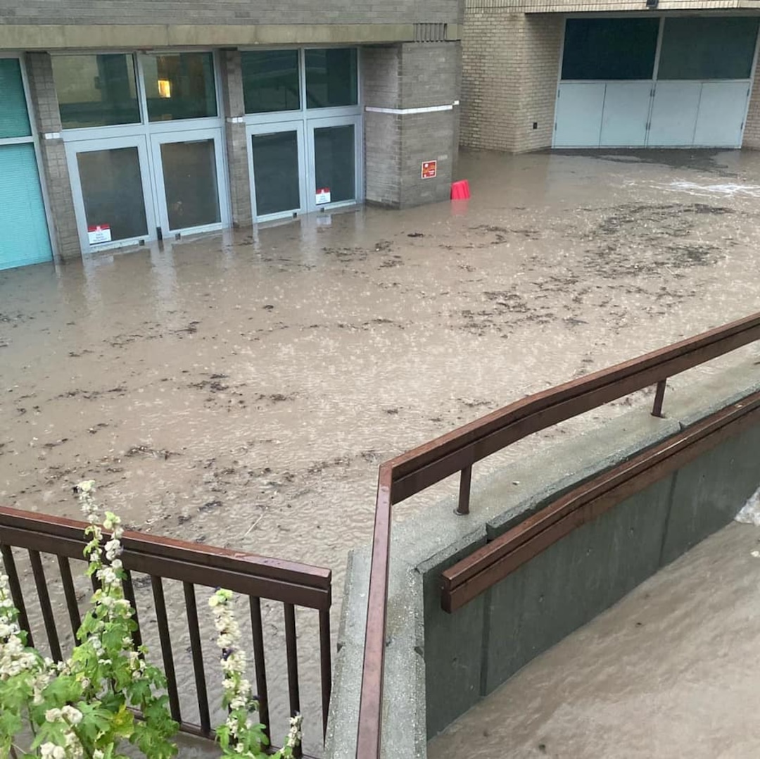 (Salt Lake City School District) The rainstorm that pounded Salt Lake City on Sunday, Aug. 2, 2021, flooded the basketball court at East High.