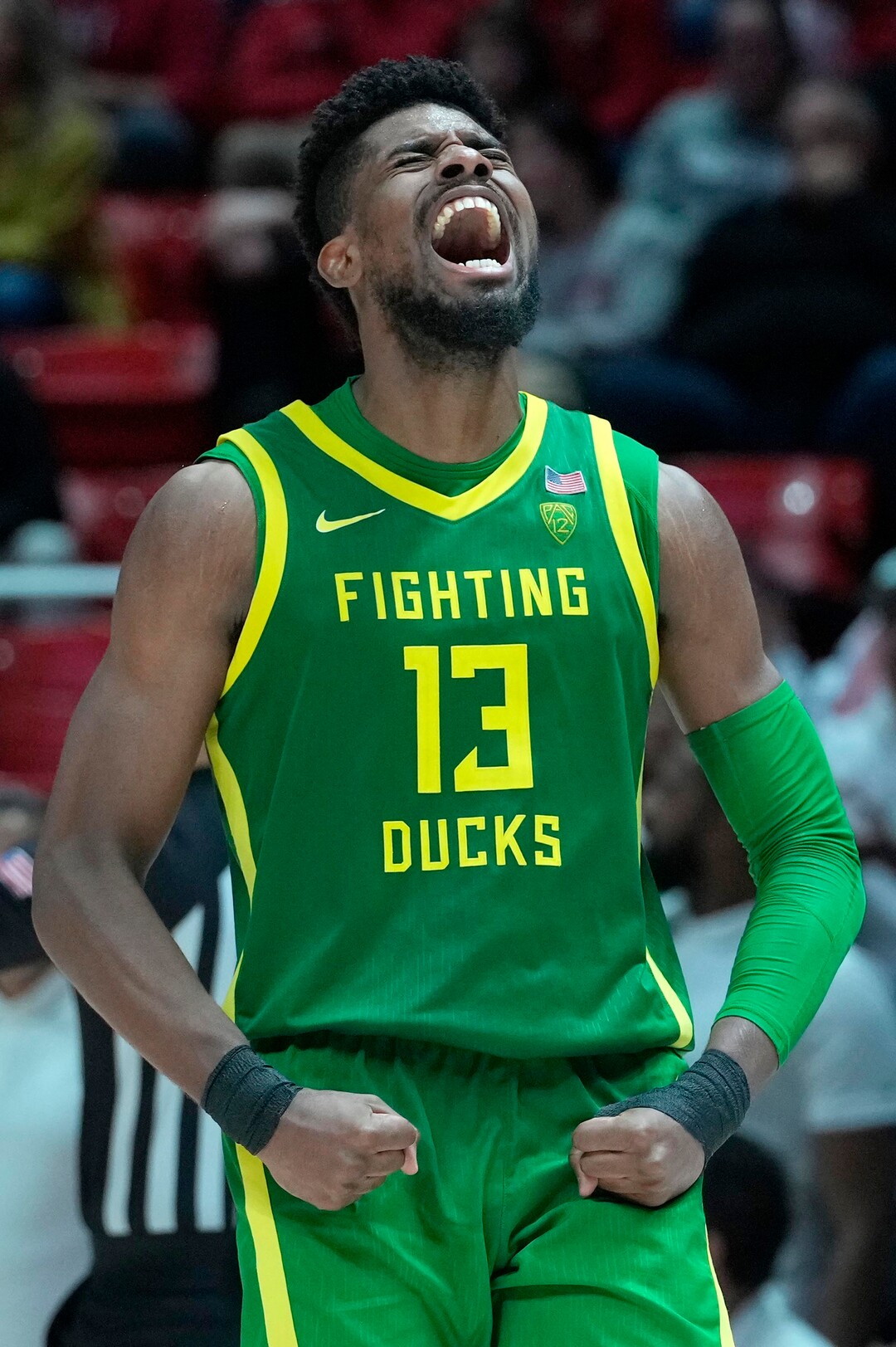 (Leah Hogsten | The Salt Lake Tribune) Oregon Ducks forward Quincy Guerrier (13) celebrates his 3-point shot in the remaining minutes of the game as the University of Utah hosts Oregon at the Huntsman Center, Jan. 7, 2023.