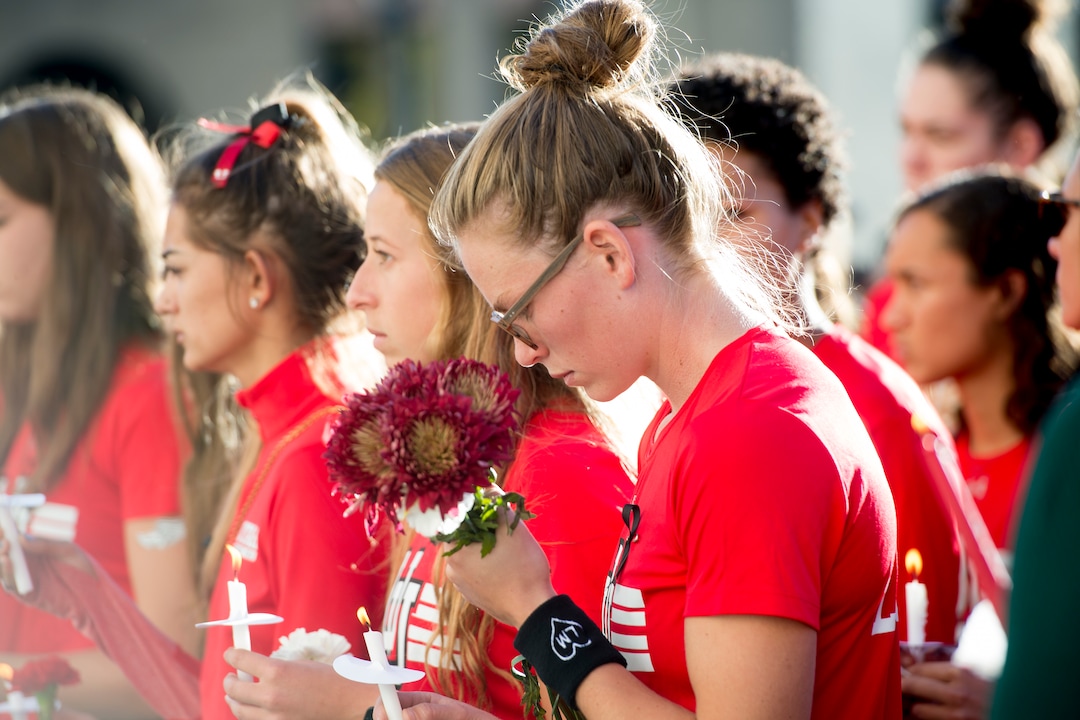 (Jeremy Harmon  |  The Salt Lake Tribune) Members of the University of Utah track team gather during a vigil for teammate Lauren McCluskey on Wed. Oct 24, 2018. McCluskey was killed on campus on Monday.