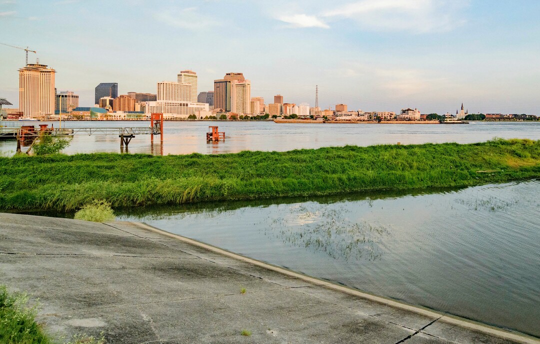 (Matthew Hinton | AP Photo) The Mississippi River approaches a levee at left in New Orleans, La., Thursday, July 11, 2019, ahead of Tropical Storm Barry. Never in the modern history of New Orleans has water from the Mississippi River overtopped the city’s levees.