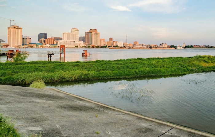 (Matthew Hinton | AP Photo) The Mississippi River approaches a levee at left in New Orleans, La., Thursday, July 11, 2019, ahead of Tropical Storm Barry. Never in the modern history of New Orleans has water from the Mississippi River overtopped the city’s levees.