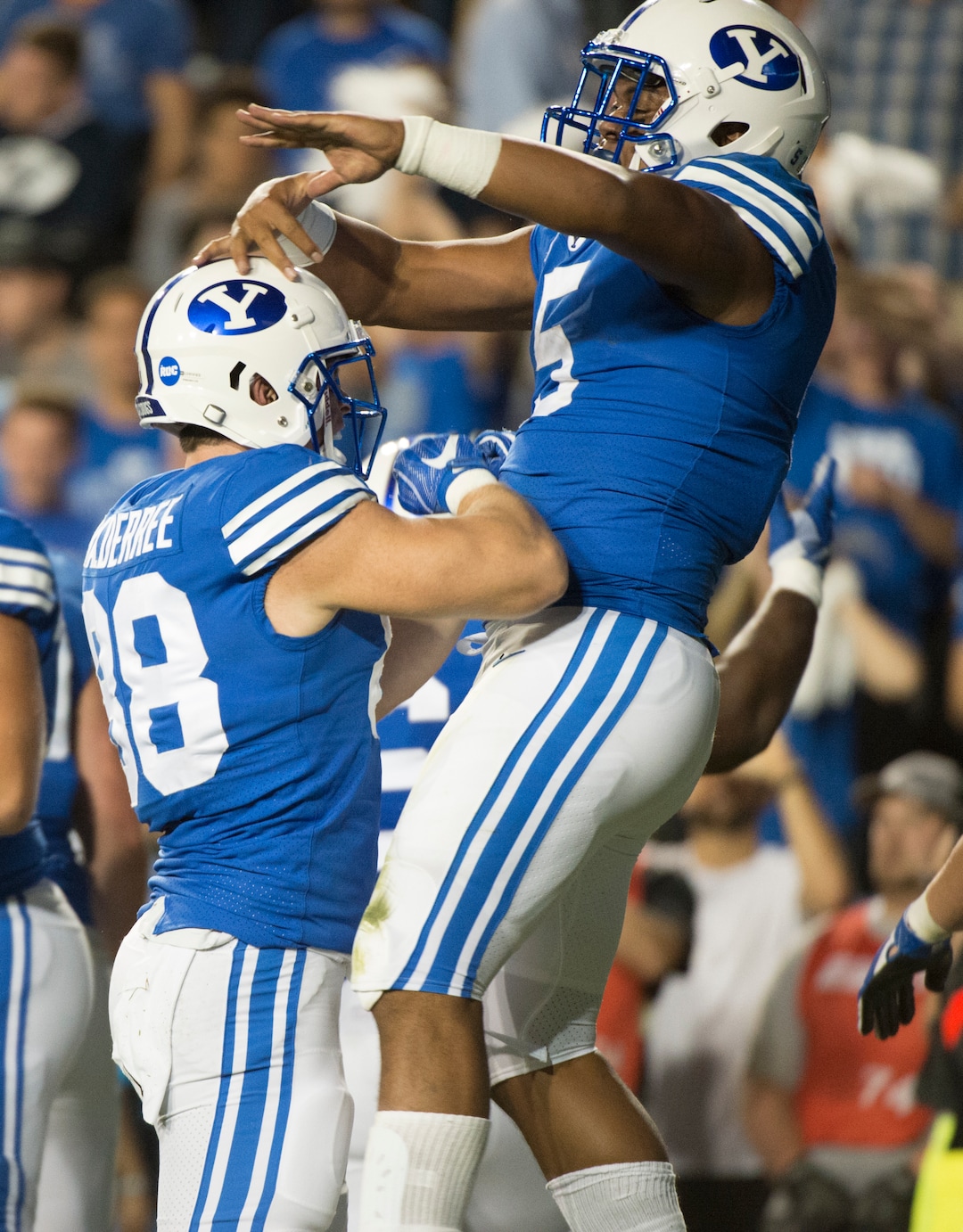 (Rick Egan  |  The Salt Lake Tribune)  The Brigham Young Cougars celebrate the touchdown by Cougar running back Ula Tolutau (5), in football action BYU vs Utah, at Lavell Edwards Stadium in Provo, Saturday, September 9, 2017.