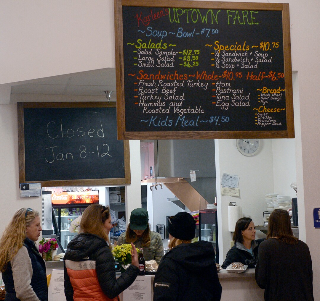 (Al Hartmann  |  The Salt Lake Tribune) Friends meet at the counter at Uptown Fare in Park City.