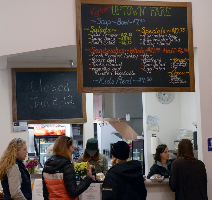 (Al Hartmann  |  The Salt Lake Tribune) Friends meet at the counter at Uptown Fare in Park City.