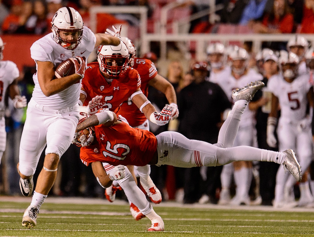 (Trent Nelson | The Salt Lake Tribune)  Utah Utes defensive back Corrion Ballard (15) dives at Stanford Cardinal tight end Kaden Smith (82) as the University of Utah hosts Stanford, NCAA football at Rice-Eccles Stadium in Salt Lake City Saturday October 7, 2017.