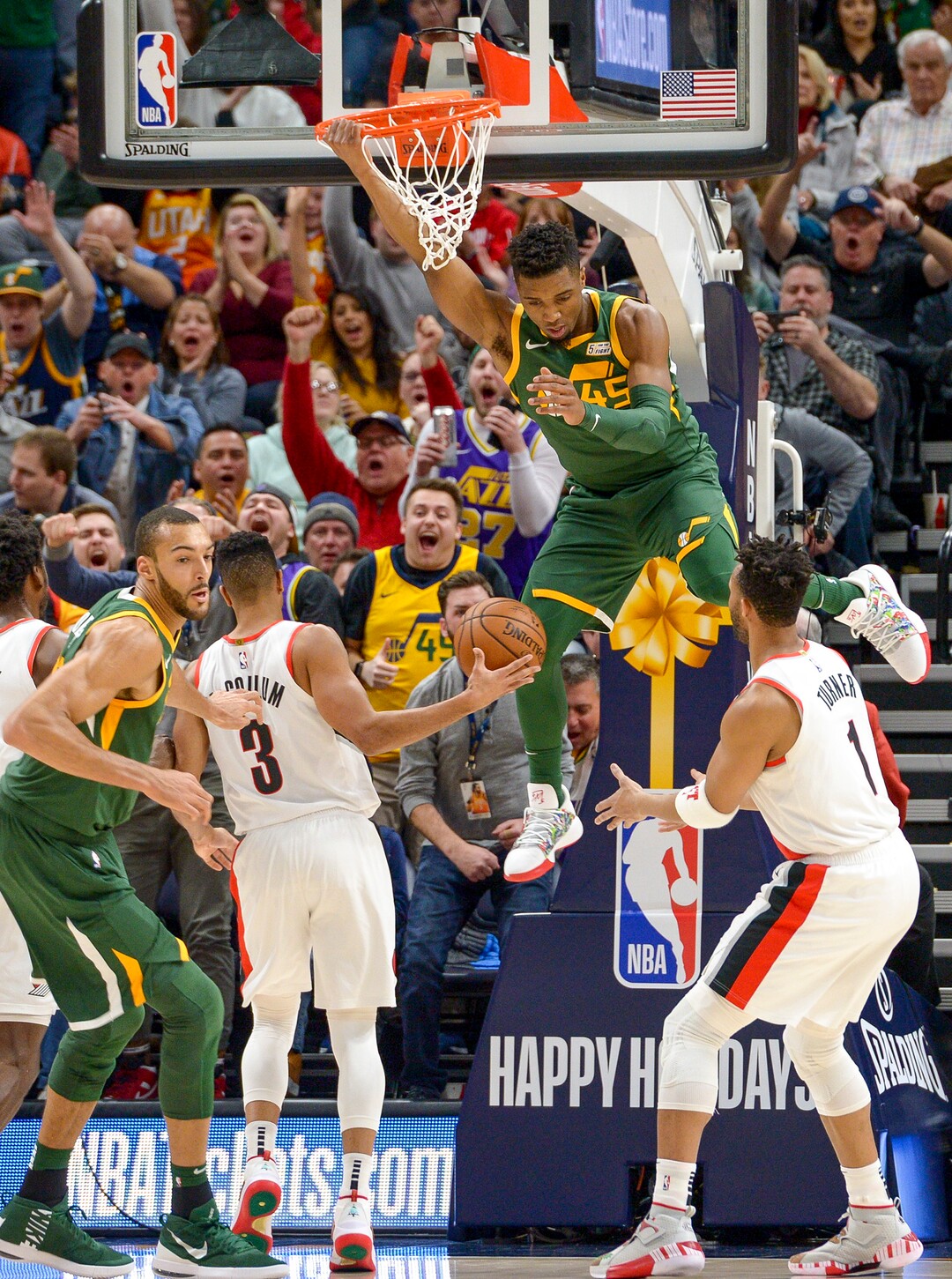 Leah Hogsten  |  The Salt Lake Tribune Utah Jazz guard Donovan Mitchell (45) dunks on the Trail Blazers as the Utah Jazz host the Portland Trail Blazers Christmas night at Vivint Smart Home Arena.