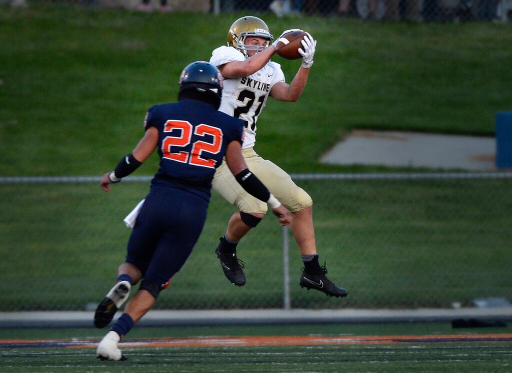 (Scott Sommerdorf   |  The Salt Lake Tribune)   
Skyline's Taylor Larsen makes a TD catch behind Brighton DB Salua Masina to tie the game at 7-7 during first half Friday.