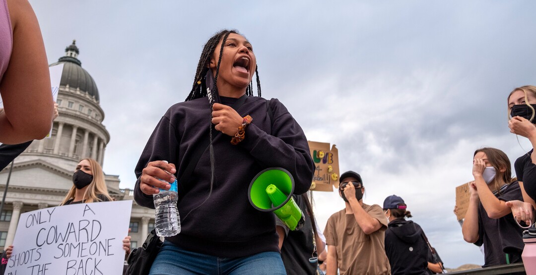 (Leah Hogsten  |  The Salt Lake Tribune) Rae Duckworth refocuses the group with chants after an anti-protester showed up. Black Lives Matter supporters and Salt Lake Equal Rights Movement members march from the Capitol to Washington Square on Monday, August 31, 2020 calling for justice for Jacob Blake who was shot in the back by police in Kenosha, Wisconsin on August 23rd.