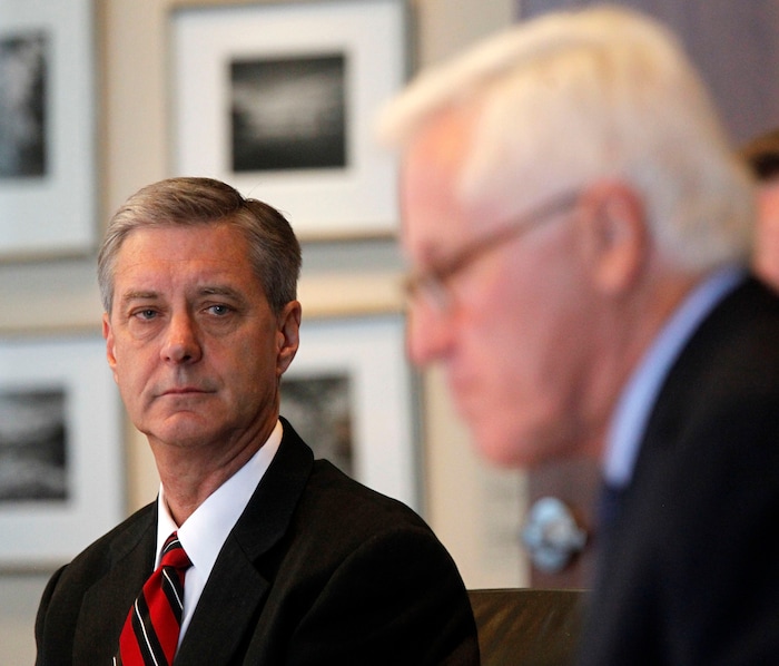 (Al Hartmann  |  Tribune File Photo)  University of Utah Athletic Director Chris Hill, left, listens to Alan Sullivan, Investigator for Snell & Wilmer present results of investigation of former University of Utah swim coach Greg Winslow in a press conference in Salt Lake City Tuesday July 2, 2013. 