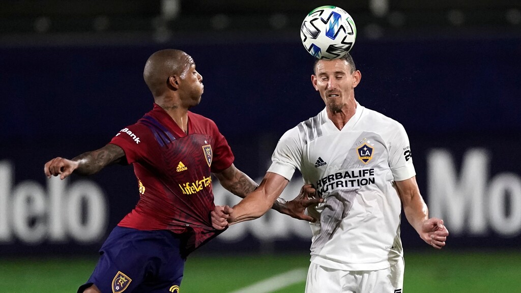 Los Angeles Galaxy's Daniel Steres, right, heads the ball against Real Salt Lake's Everton Luiz during the first half of an MLS soccer match, Sunday, Nov. 1, 2020, in Carson, Calif. (AP Photo/Jae C. Hong)