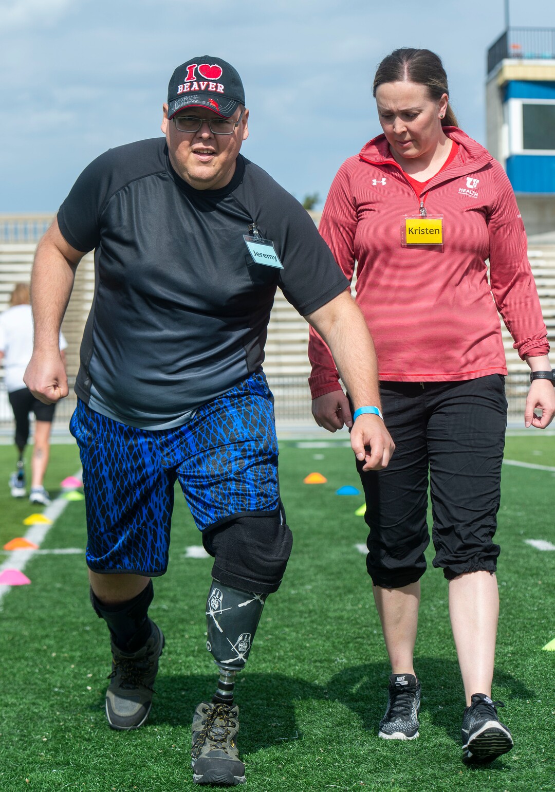 (Rick Egan  |  The Salt Lake Tribune)      Jeremy Wayman, from Kearns, is assisted by Kristen Black-Bain, during the fourth annual Utah Adaptive Mobility Clinic at Skyline High school. The clinic allows anyone with "lower extremity limb loss or limb difference" or amputees without legs, to practice walking and running. Saturday, June 1, 2019.
