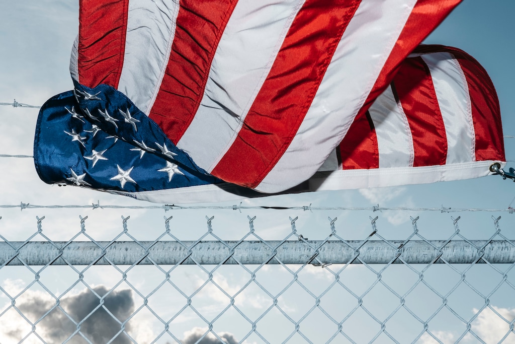 (Erin Kirkland | The New York Times)
An American flag blows in the breeze outside the General Motors Flint Assembly Plant in Flint, Mich., on Monday, Sept. 23, 2019. "In terms of our well-being at home and competitiveness abroad, the blunt truth is that America is lagging. In some respects, we are sliding toward mediocrity," writes The New York Times opinion columnist Nicholas Kristof.