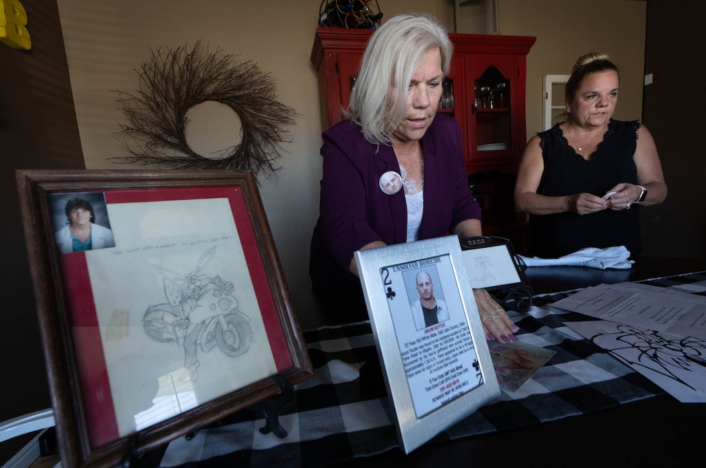 (Francisco Kjolseth | The Salt Lake Tribune) Stephani Perschon, left, and her sister Niki Price talk about their brother Jason Royter, whose 2005 homicide In Magna remains unsolved. The Unified Police Department recently released a deck of playing cards with each card showing a photo and description of a cold case or missing person.