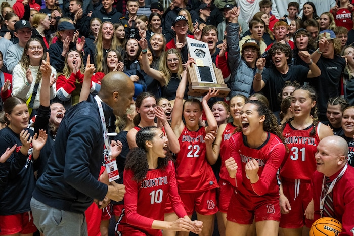(Rick Egan | The Salt Lake Tribune) The Bountiful Redhawks celebrate their win over the Springville Red Devils, for the Girls 5A State Championship at Weber State, on Saturday, March 4, 2023.
