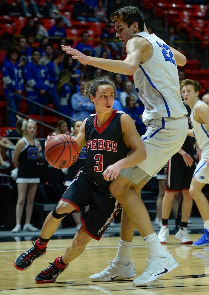 (Francisco Kjolseth  |  The Salt Lake Tribune)  Weber vs Pleasant Grove, 6A State high school basketball tournament at the Huntsman Center in Salt Lake City, Thursday March 1, 2018. Hudson Schenck (3) is dwarfed by Matthew Van Women (22), on his way to the basket. 