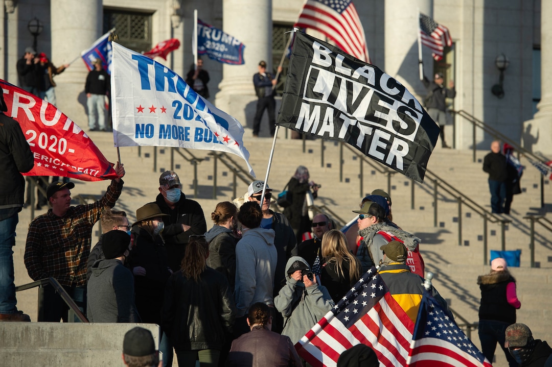 (Francisco Kjolseth  | The Salt Lake Tribune) A small group carrying a Black Lives Matter flag are pressured by Trump supporters before ripping away their flag during a pro-Trump rally at the Utah State Capitol in Salt Lake City on Wednesday, Jan. 6, 2021.