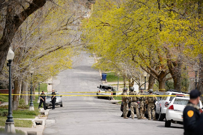 (Trent Nelson | The Salt Lake Tribune)  
Law enforcement at the scene after an incident where a man barricaded himself in a house on Princeton Avenue near 1100 East in Salt Lake City, Wednesday April 18, 2018.