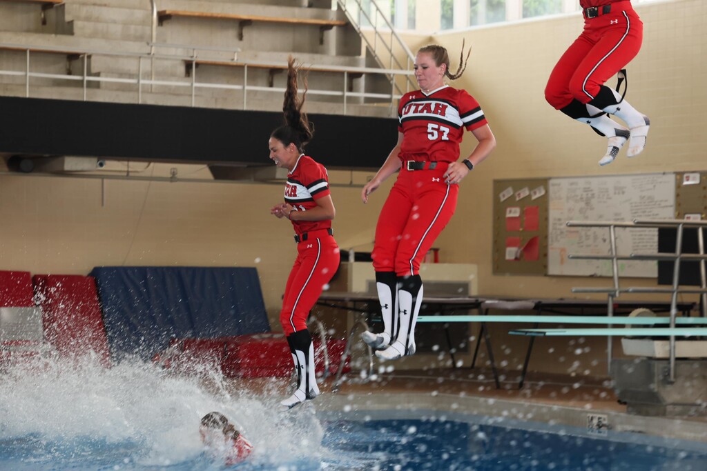 (University of Utah Athletics) Members of the Utah Utes softball team jump into the swimming and diving pool on campus after a win. Jumping in the pool is a tradition that dates back to 1991.