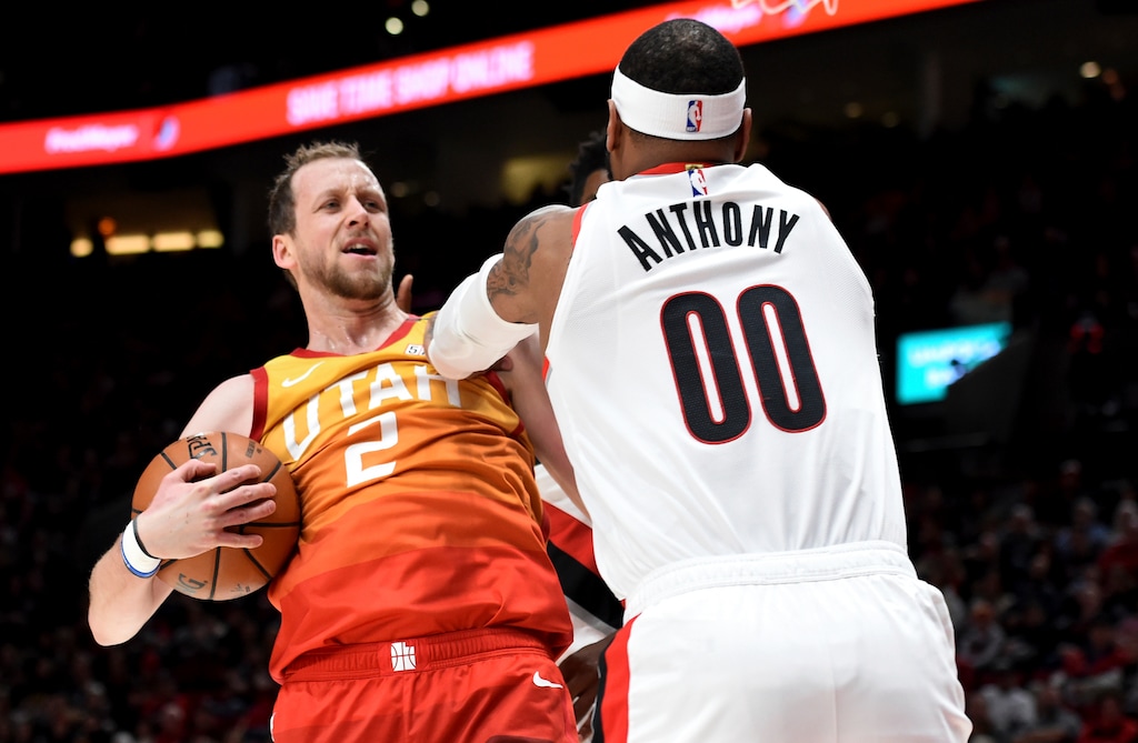 Utah Jazz guard Joe Ingles, left, gets into a scuffle with Portland Trail Blazers forward Carmelo Anthony during the first half of an NBA basketball game in Portland, Ore., Saturday, Feb. 1, 2020. (AP Photo/Steve Dykes)