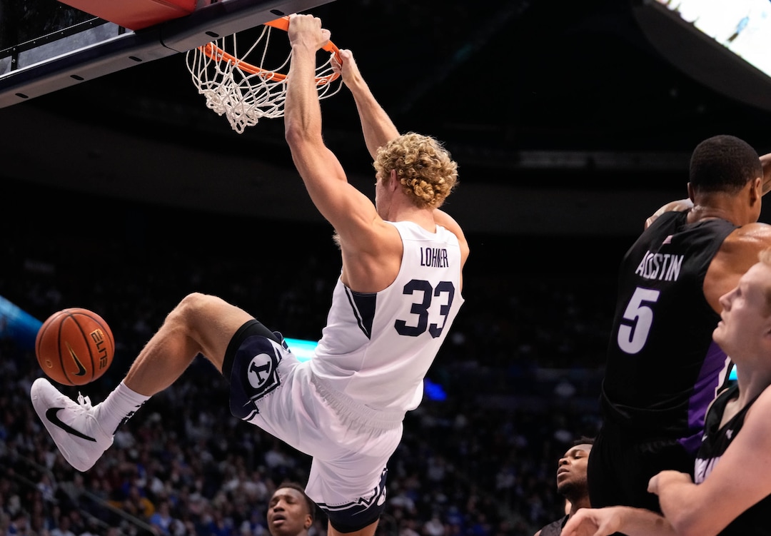 (Francisco Kjolseth | The Salt Lake Tribune) Brigham Young Cougars forward Caleb Lohner (33) dunks the ball in WCC basketball action between the Brigham Young Cougars and the Portland Pilots, at the Marriott Center, on Saturday, January 22, 2022.