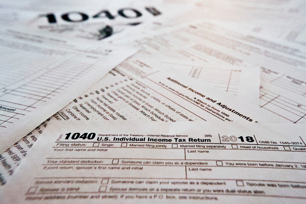 (Keith Srakocic | The Associated Press) This Wednesday, Feb. 13, 2019, in Zelienople, Pa., shows multiple forms printed from the Internal Revenue Service web page that are used for 2018 U.S. federal tax returns. The government says that the average tax refund and the total amount of refunds issued have declined for the second straight week. The declines have become a political issue, as Democrats contend they show how the new Republican-written tax law hurts middle-class people.