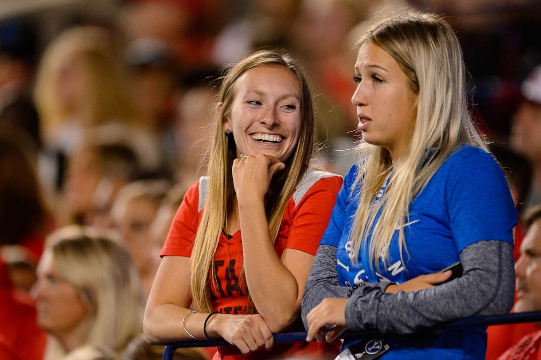 (Trent Nelson | The Salt Lake Tribune)  BYU tennis teammates Demi Perkinson, in red, and Natella Nabieva hosts watch as BYU football hosts Utah at Lavell Edwards Stadium on Saturday September 9, 2017.