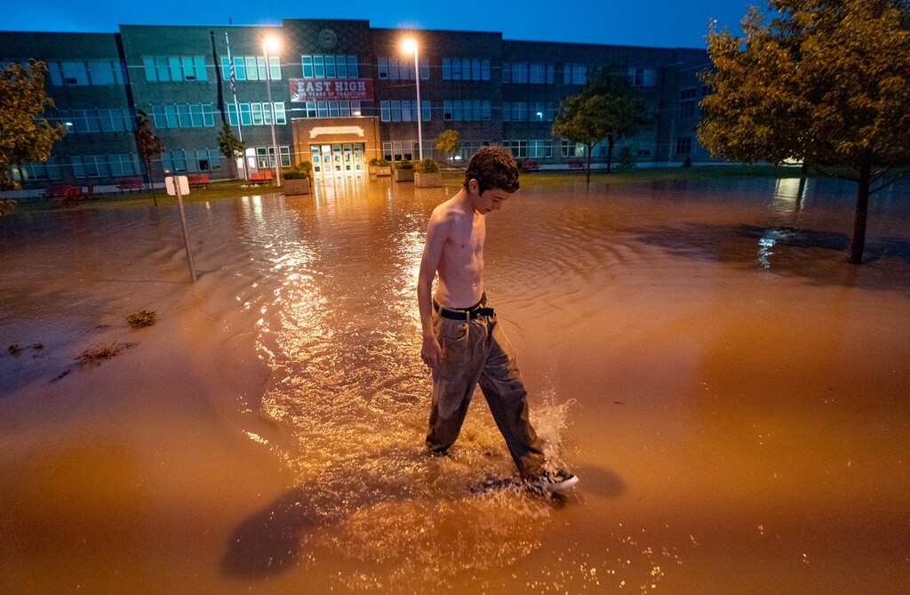 (Francisco Kjolseth | The Salt Lake Tribune) East High student Jack Atkinson, 15, who is starting 10th grade this fall, checks out the flooding at his school after a torrential downpour on Sunday, Aug. 1, 2021.