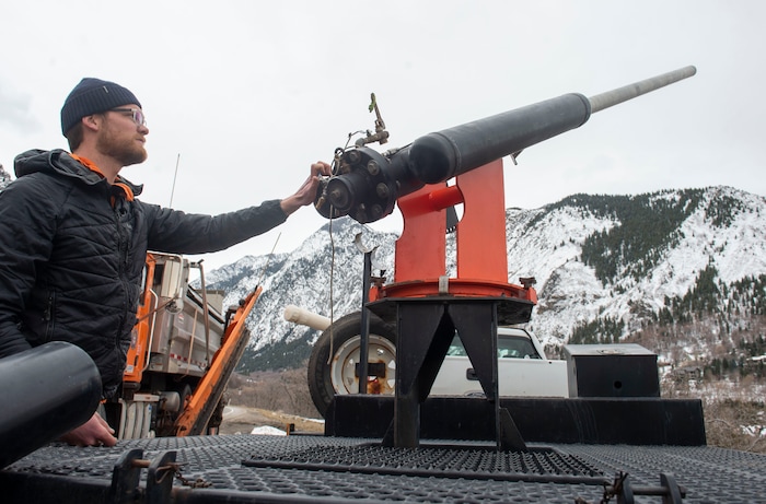 (Rick Egan | The Salt Lake Tribune) Steven Clark, Avalanche Forecaster for the Utah Department of Transportation, demonstrates how to load the Avalauncher, which uses compressed gas to fire a projectile that explodes and triggers avalanches. Tuesday, March 5, 2019.