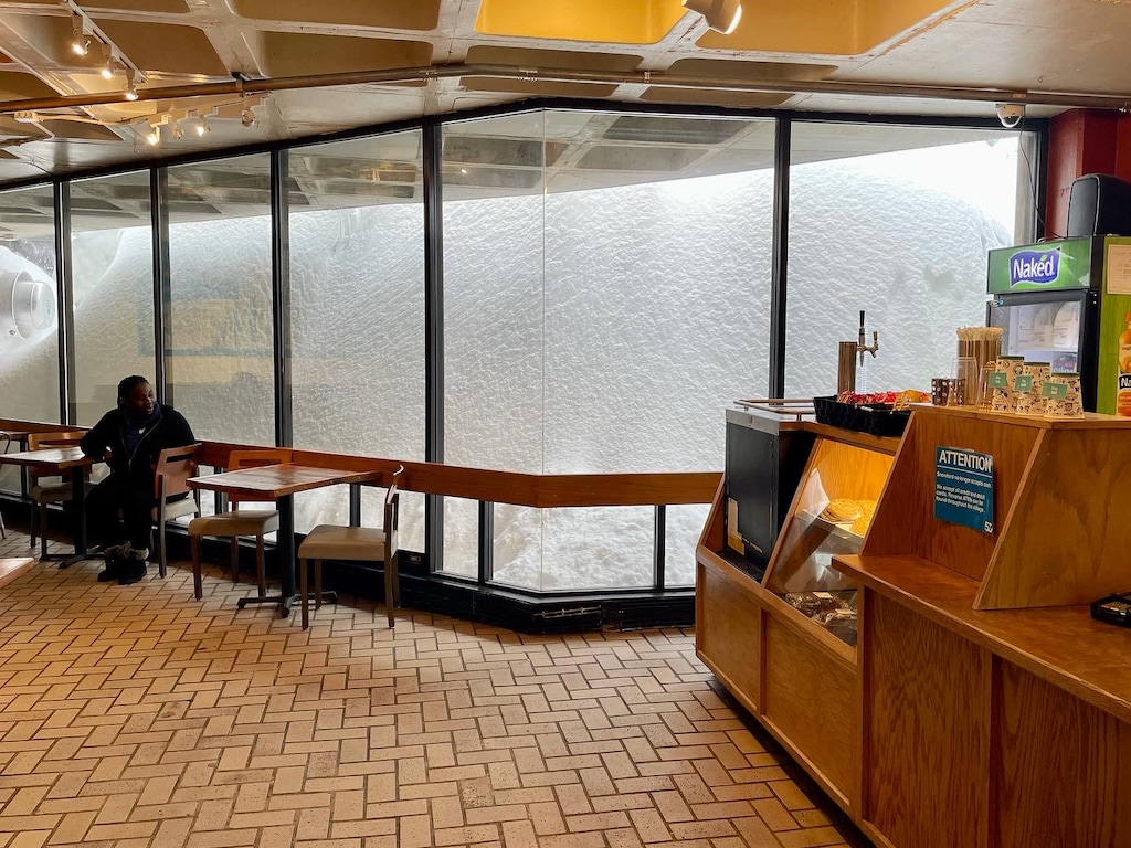 Sarah Sherman/Snowbird
A wall of snow piles up outside a cafe during an interlodge at Snowbird on April 4, 2023. The resort got 15 inches in 12 hours between Monday and Tuesday to set a season snowfall record of 785 inches.