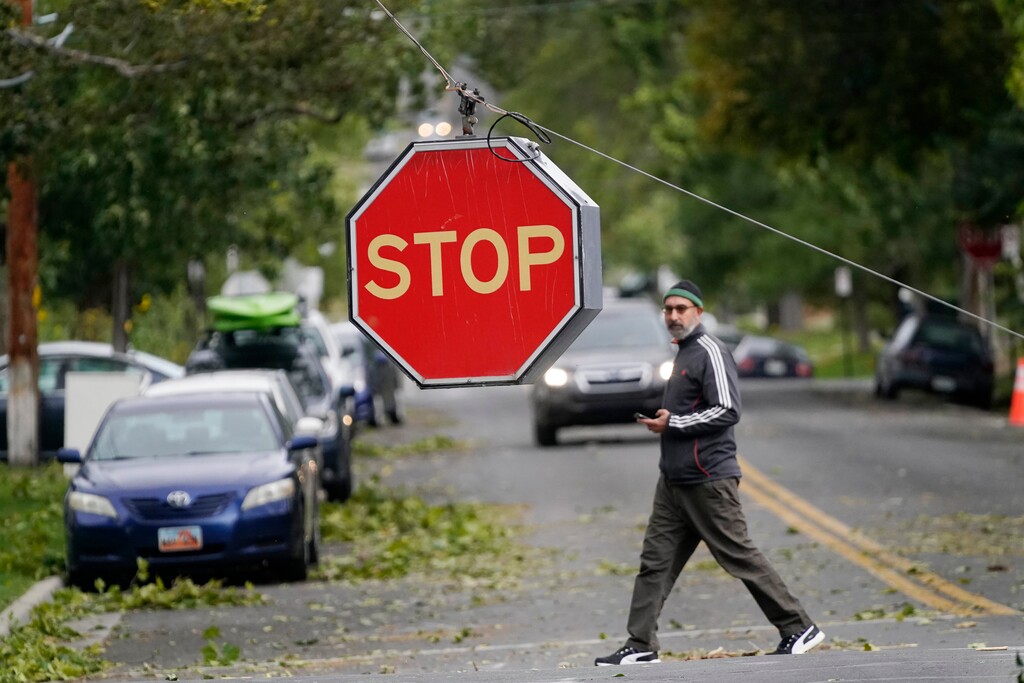 (Rick Bowmer | AP file photo) A stop sign hangs after high winds caused widespread damage and power outages Tuesday, Sept. 8, 2020, in Salt Lake City. Strong winds knocked out power in northern Utah, where temperatures dropped by 40 degrees.